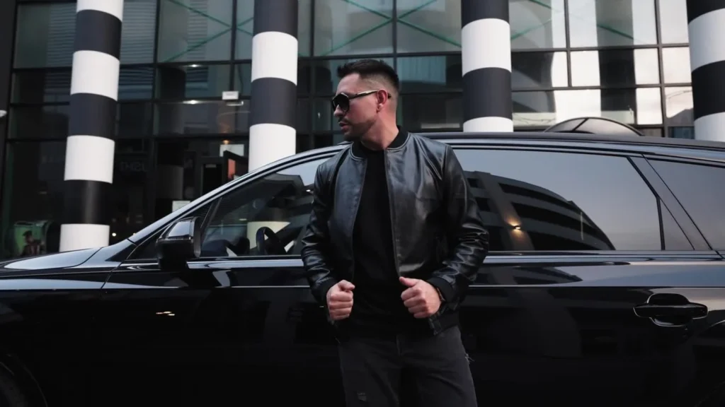 Man presenting a Denley outfit in an advertising film