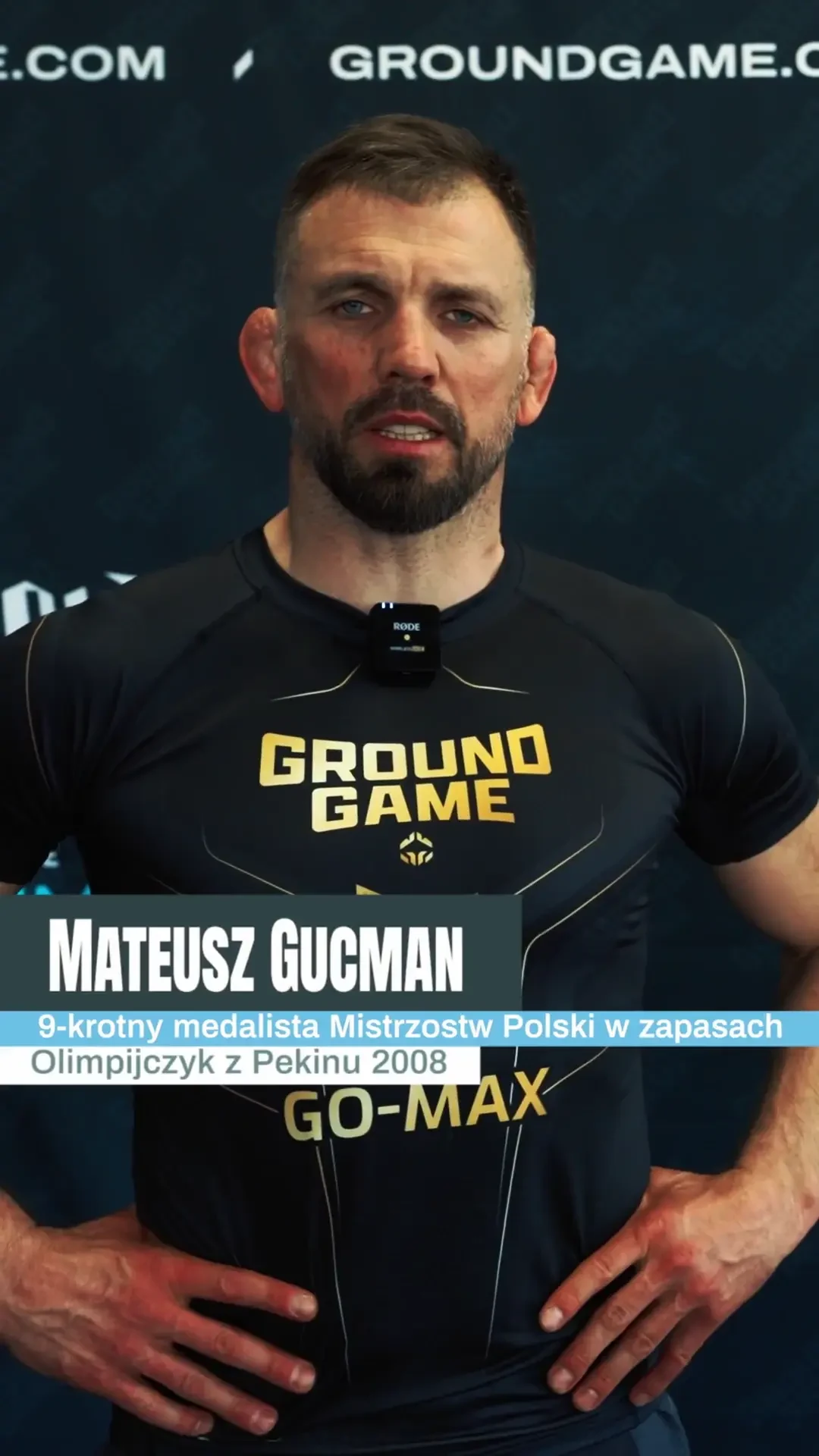 Mateusz Gucman demonstrating a fighting technique with a partner on a Ground Game Academy mat