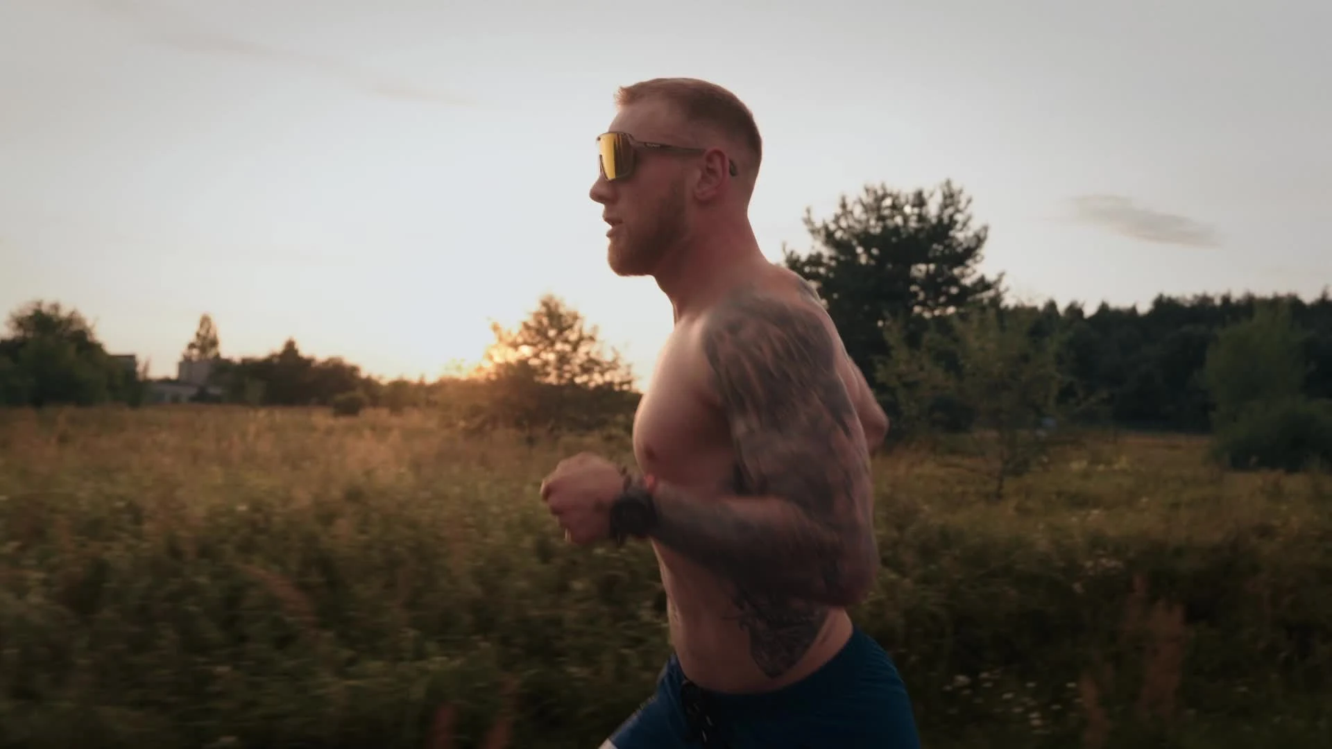 Runner wearing glasses during a sunset run